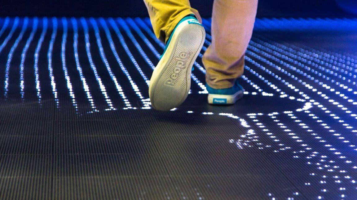 person walking in an IBM event installation